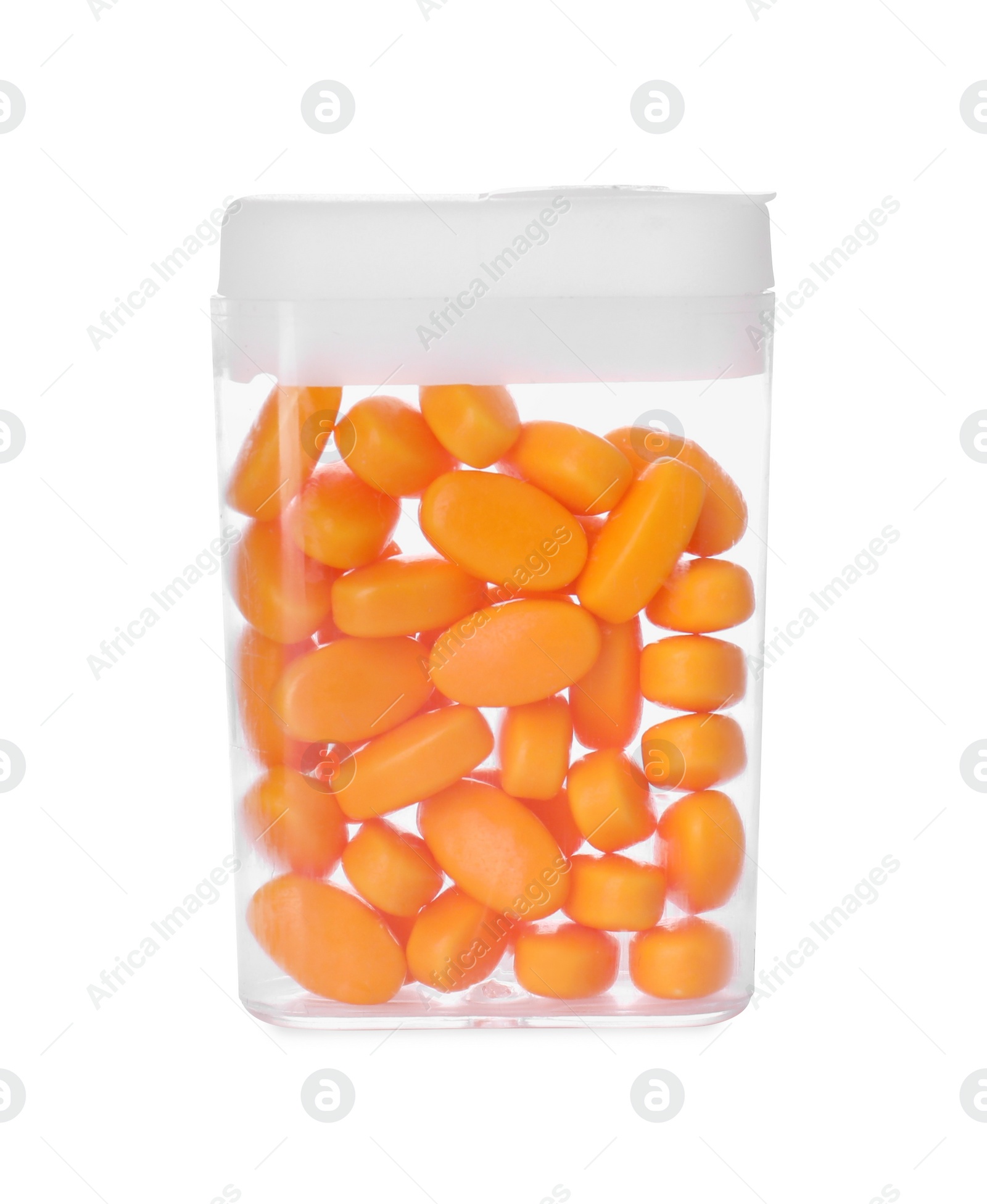 Photo of Tasty orange dragee candies in box isolated on white