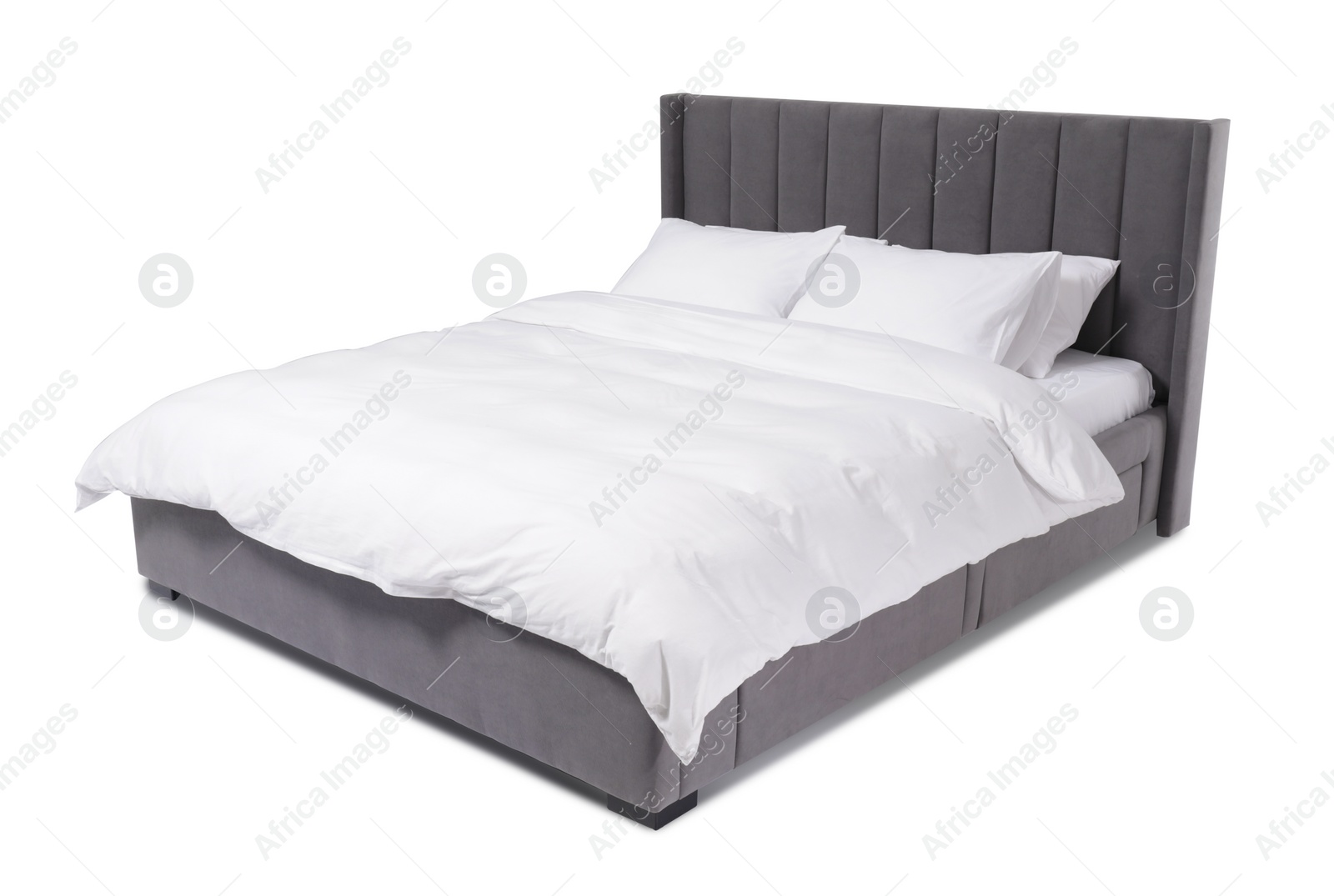 Photo of Comfortable gray bed with linens on white background