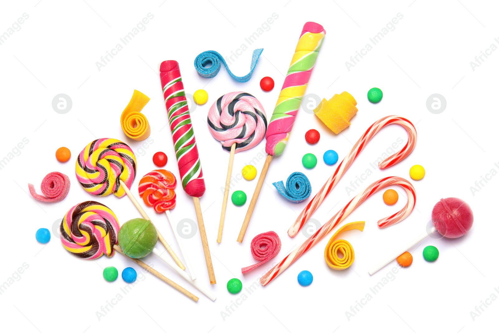 Photo of Composition with different yummy candies on white background, top view