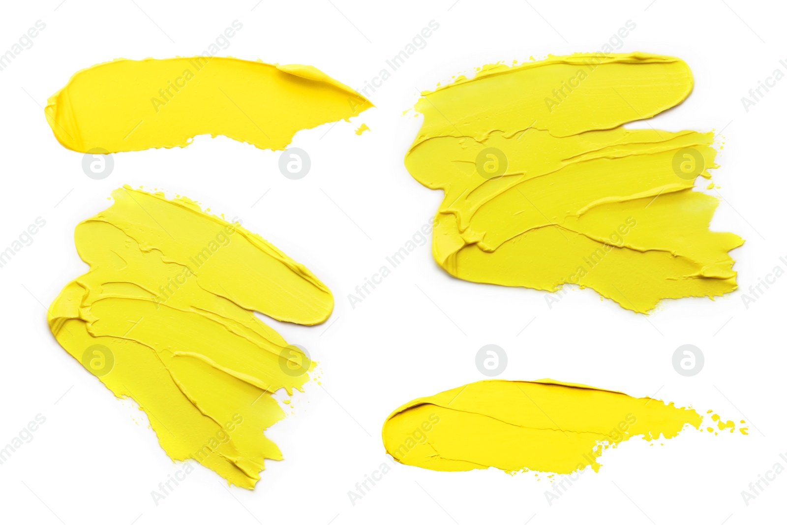 Image of Yellow oil paint strokes isolated on white, top view