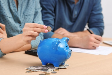 Photo of Young couple discussing pension plan at home, closeup