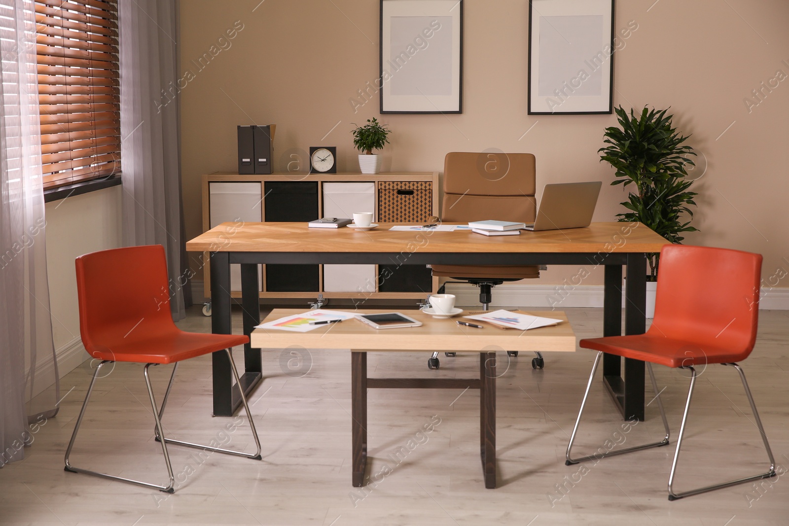 Photo of Director's office with large wooden table. Interior design