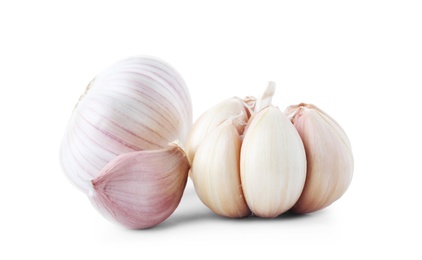 Photo of Fresh garlic bulbs and clove on white background