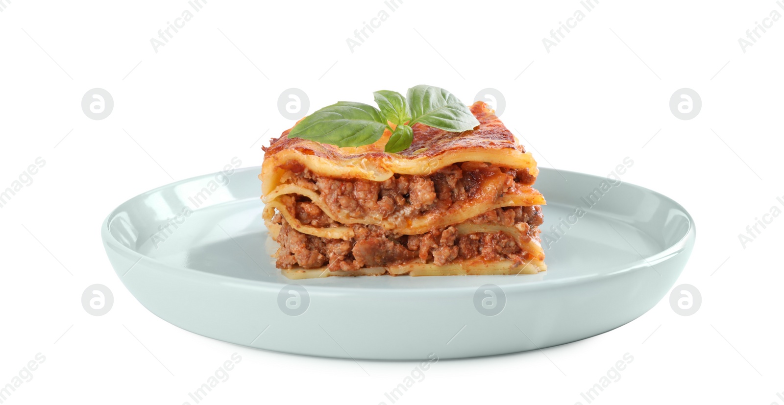 Photo of Plate with tasty cooked lasagna isolated on white