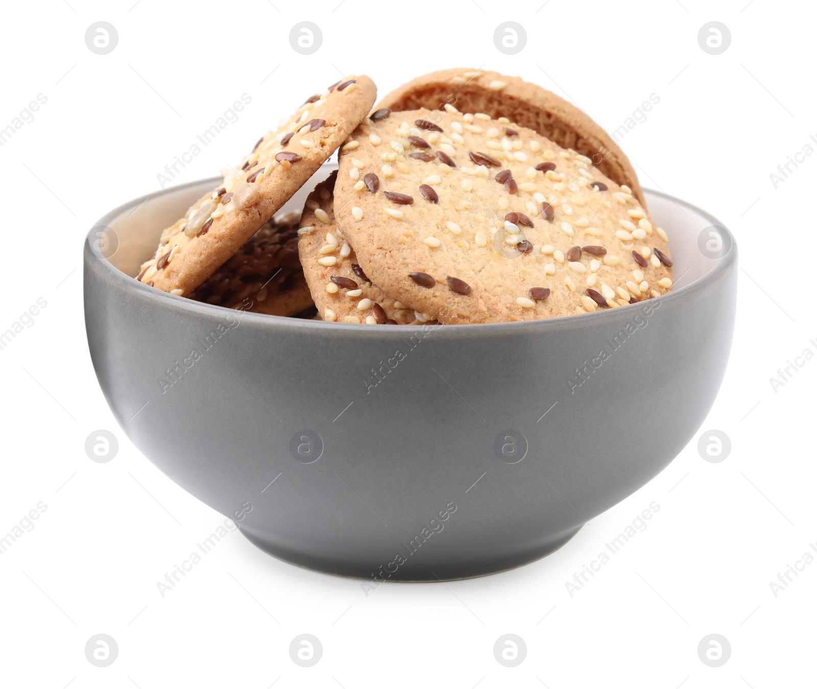 Photo of Round cereal crackers with flax, sunflower and sesame seeds in bowl isolated on white