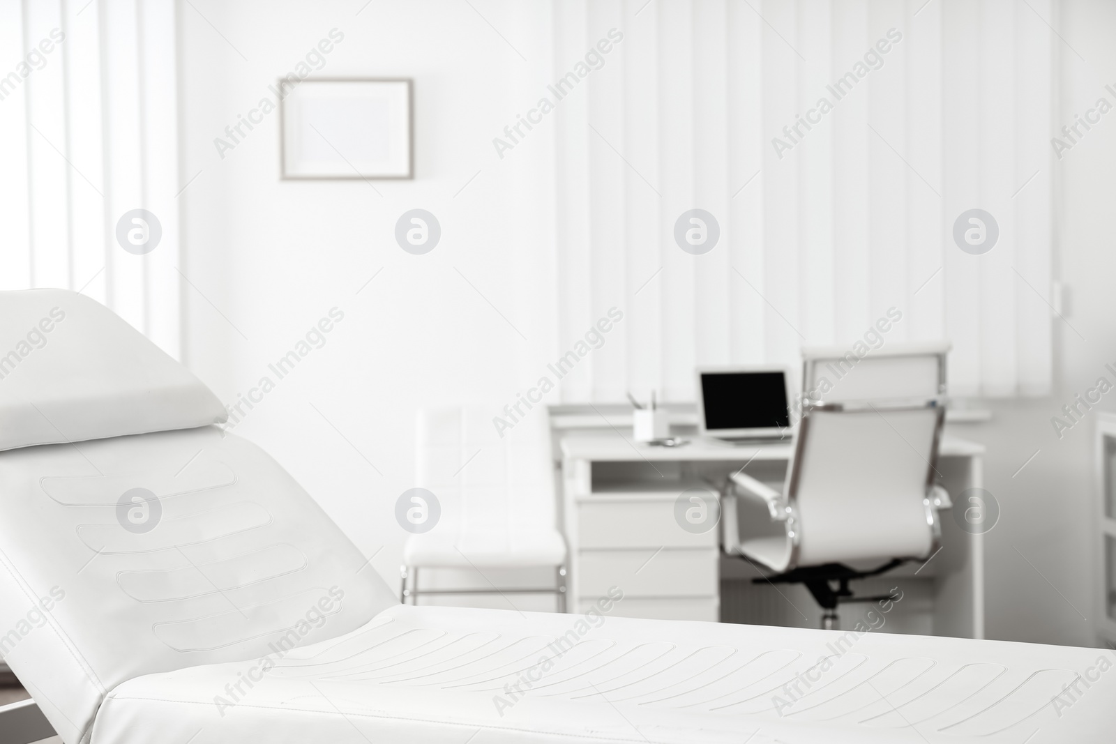 Photo of Modern medical examination couch in doctor's office