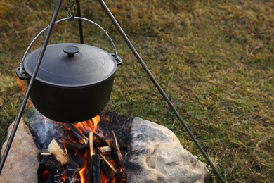 Photo of Cooking food on campfire outdoors. Camping season