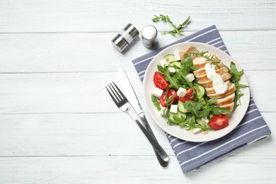 Photo of Delicious salad with chicken, arugula and tomatoes on white wooden table, flat lay. Space for text
