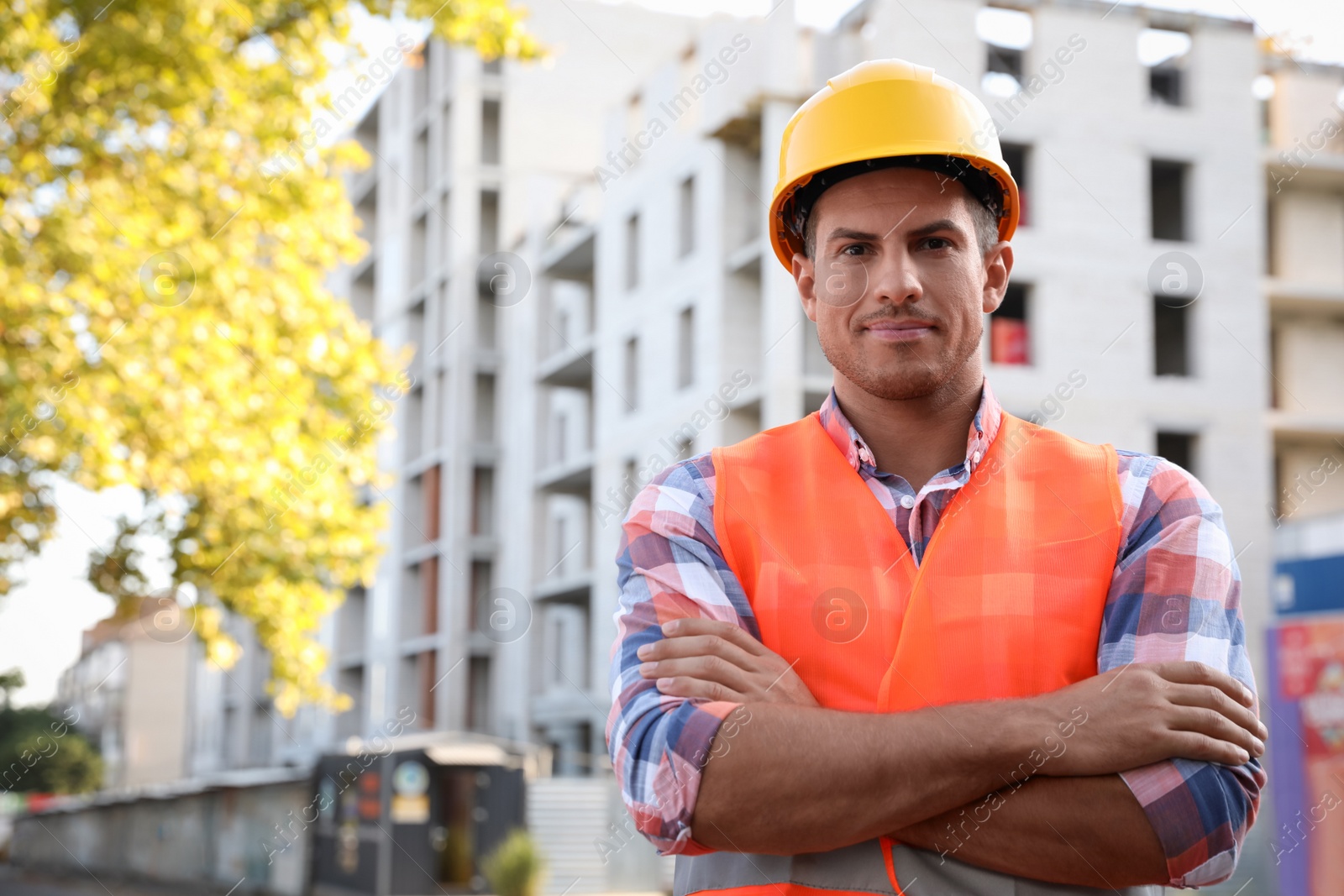 Photo of Professional engineer in safety equipment at construction site