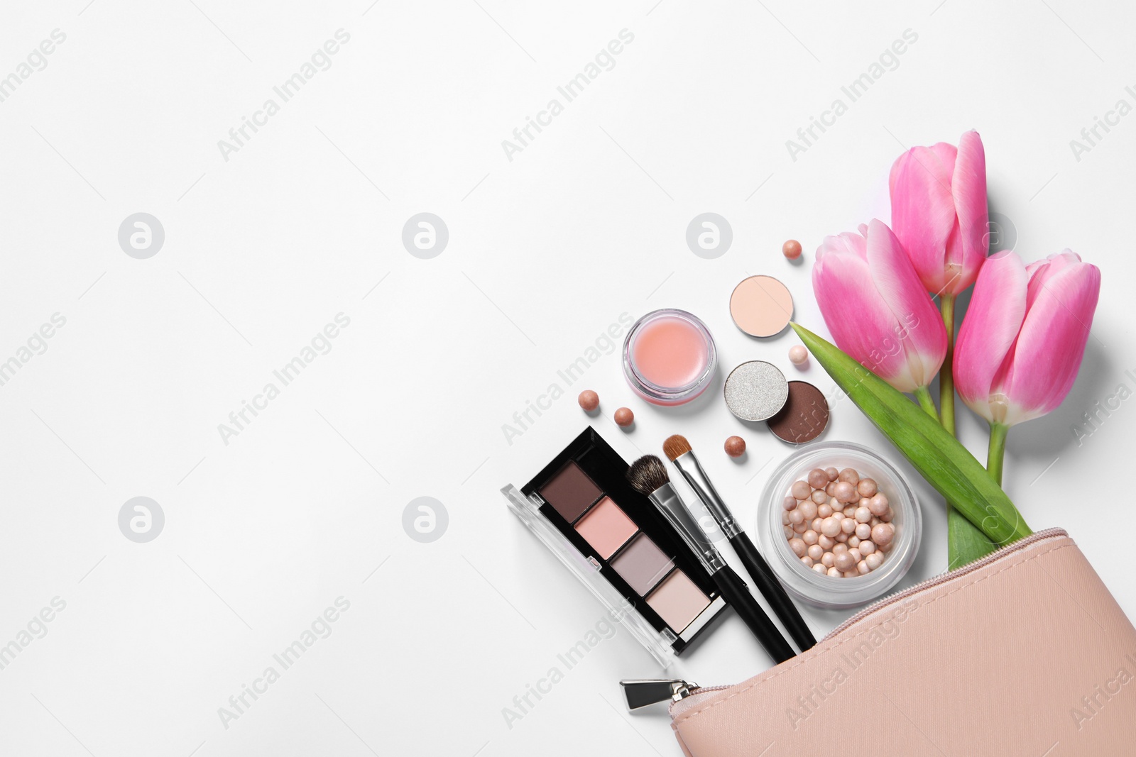 Photo of Flat lay composition with different makeup products and beautiful tulips on white background, space for text