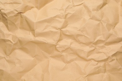 Texture of brown crumpled paper as background, closeup