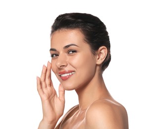 Photo of Woman applying cream under eyes on white background. Skin care