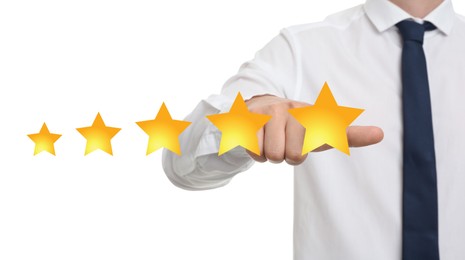 Quality evaluation. Businessman touching virtual golden star on white background, closeup