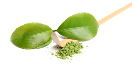 Photo of Powdered matcha tea and green leaves on white background