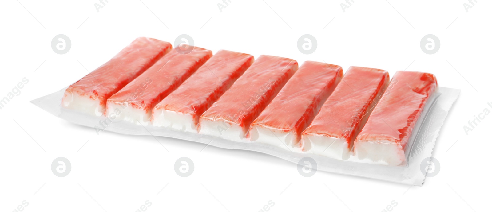 Photo of Pack of fresh crab sticks isolated on white