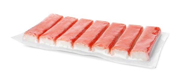 Pack of fresh crab sticks isolated on white