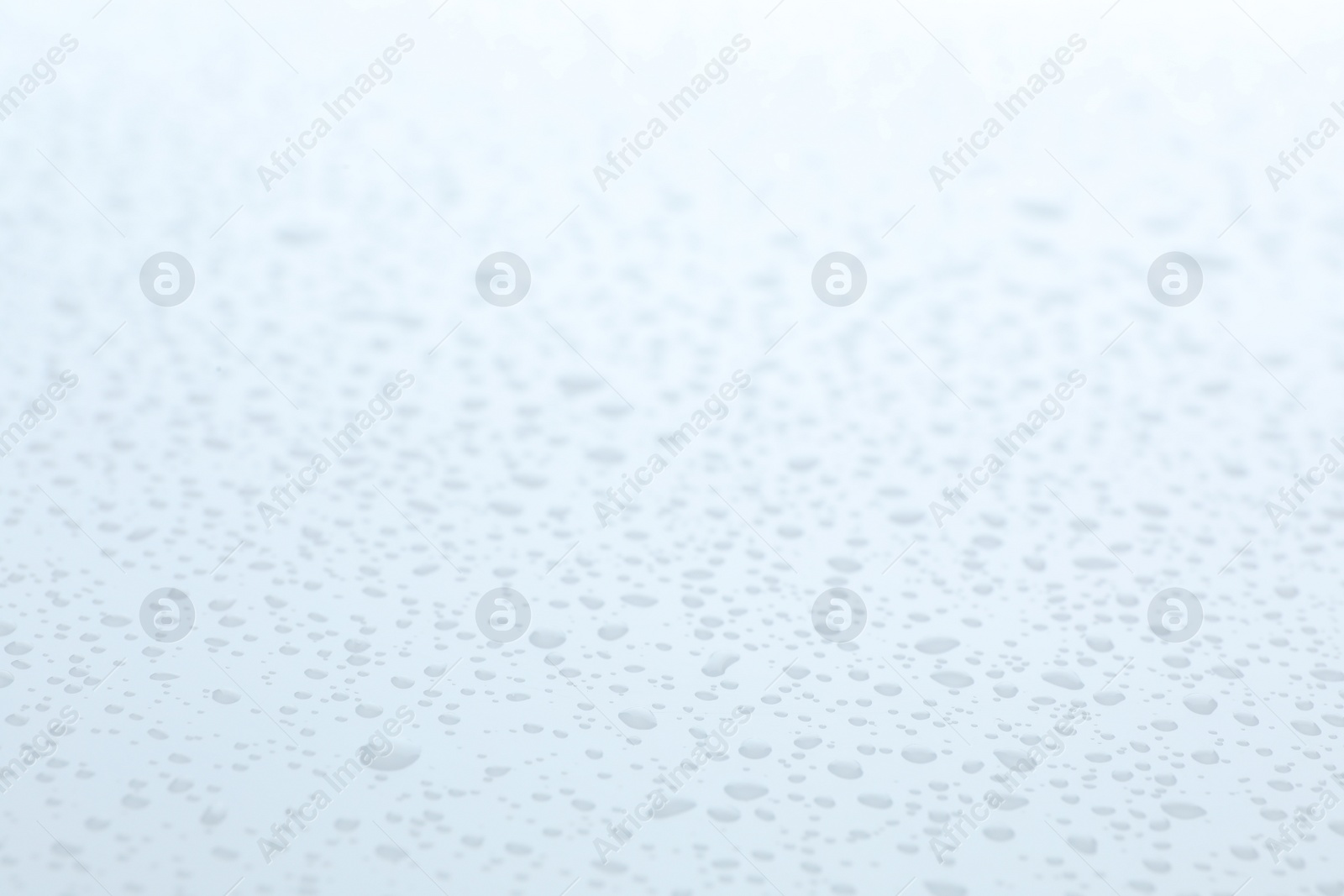 Photo of Water drops on white background, closeup view