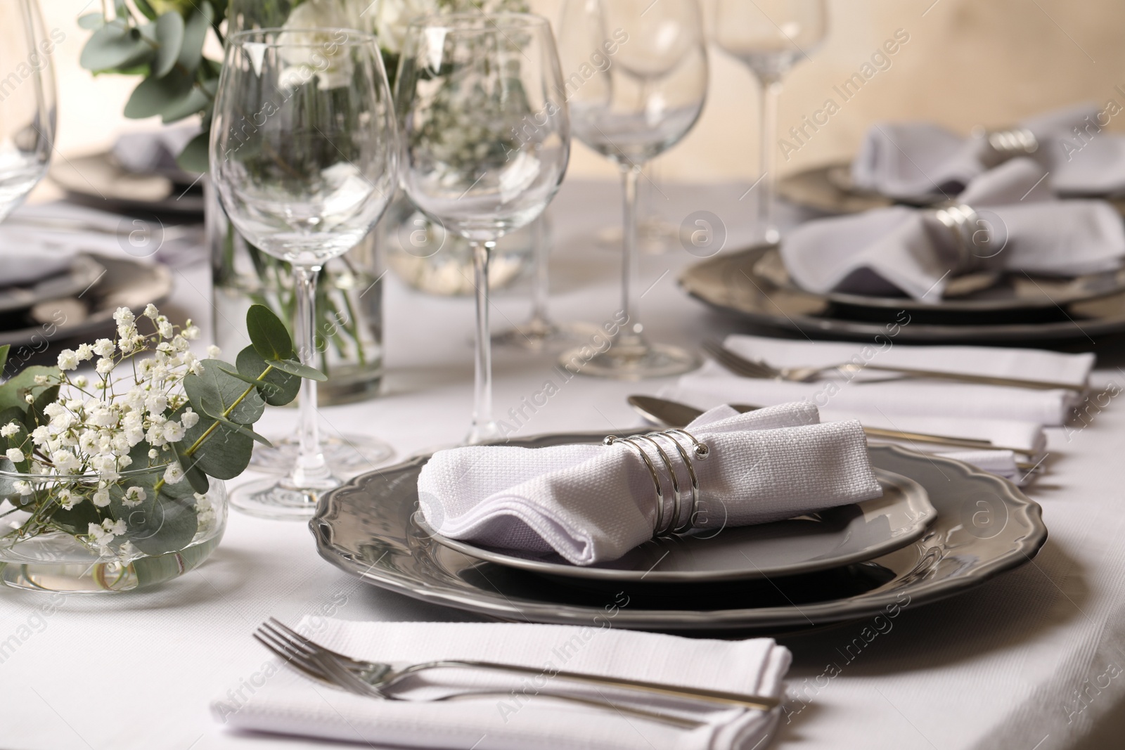 Photo of Stylish elegant table setting for festive dinner in restaurant