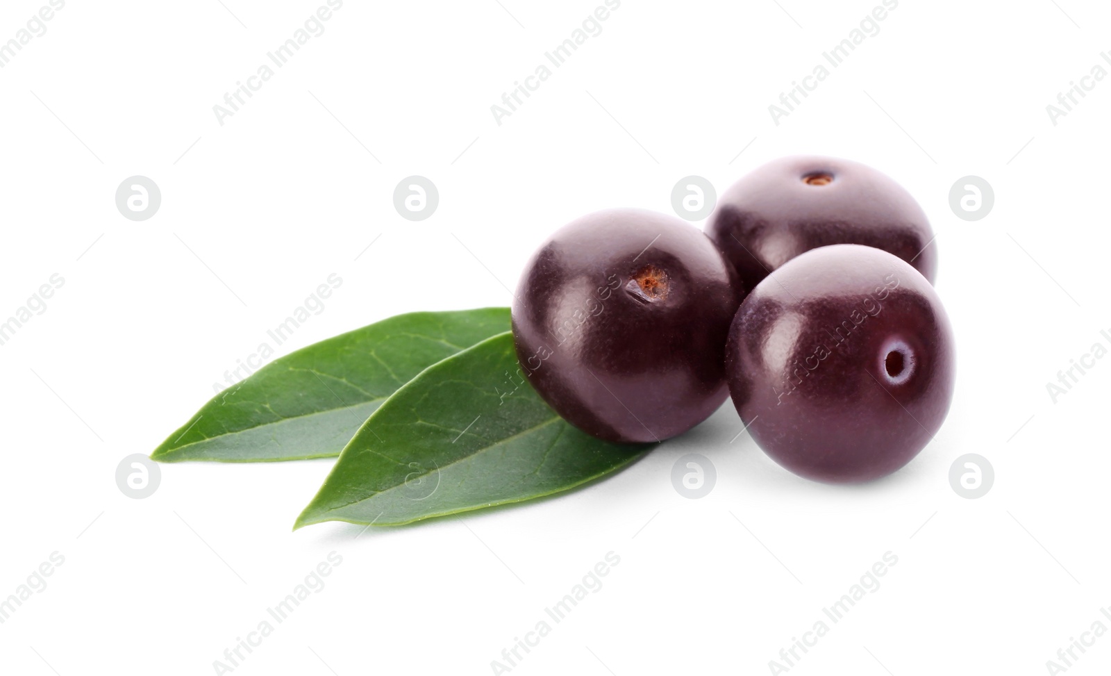 Photo of Fresh acai berries with leaves isolated on white