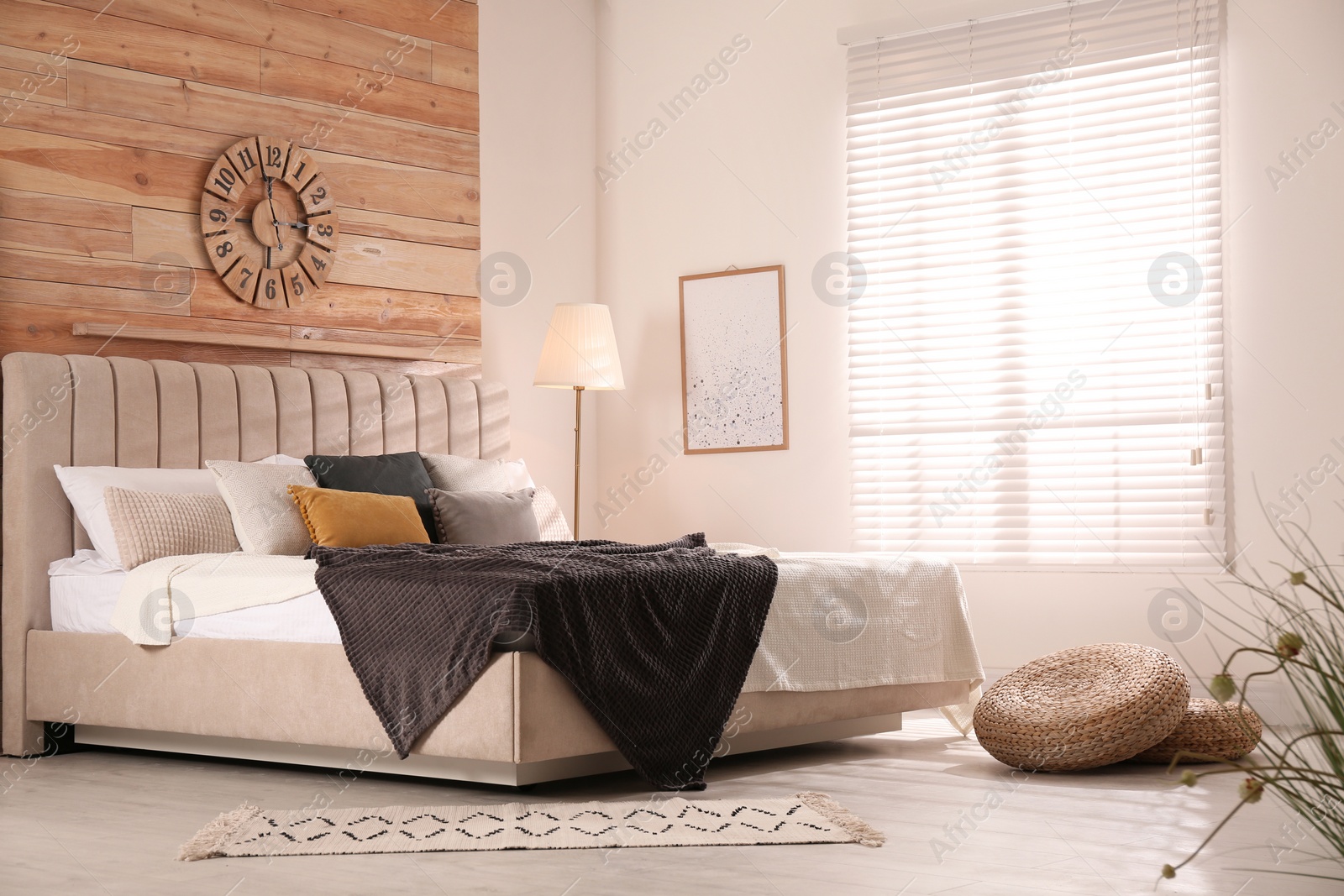 Photo of Stylish room interior with big comfortable bed