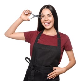 Photo of Portrait of happy hairdresser with professional scissors on white background