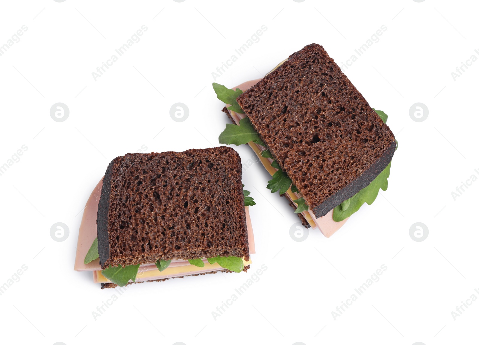 Photo of Delicious sandwiches with boiled sausage, cheese and arugula isolated on white, top view