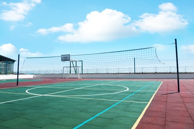 Image of Volleyball court with net on sunny day