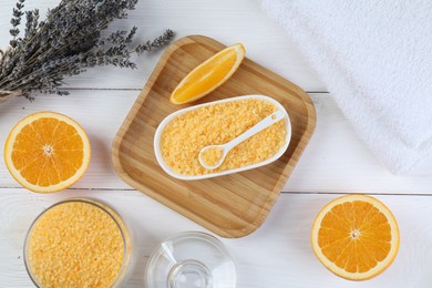 Photo of Sea salt, lavender, orange and towels on white wooden table, flat lay