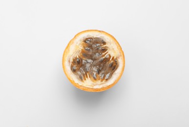 Photo of Half of granadilla on white background, top view