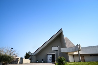 Photo of Exterior of modern church on sunny day