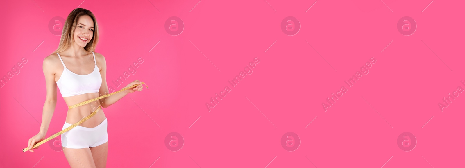 Image of Slim woman measuring her waist on pink background, space for text. Banner design