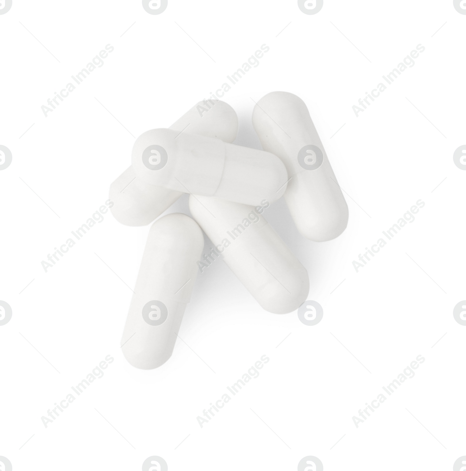 Photo of Vitamin capsules isolated on white, top view