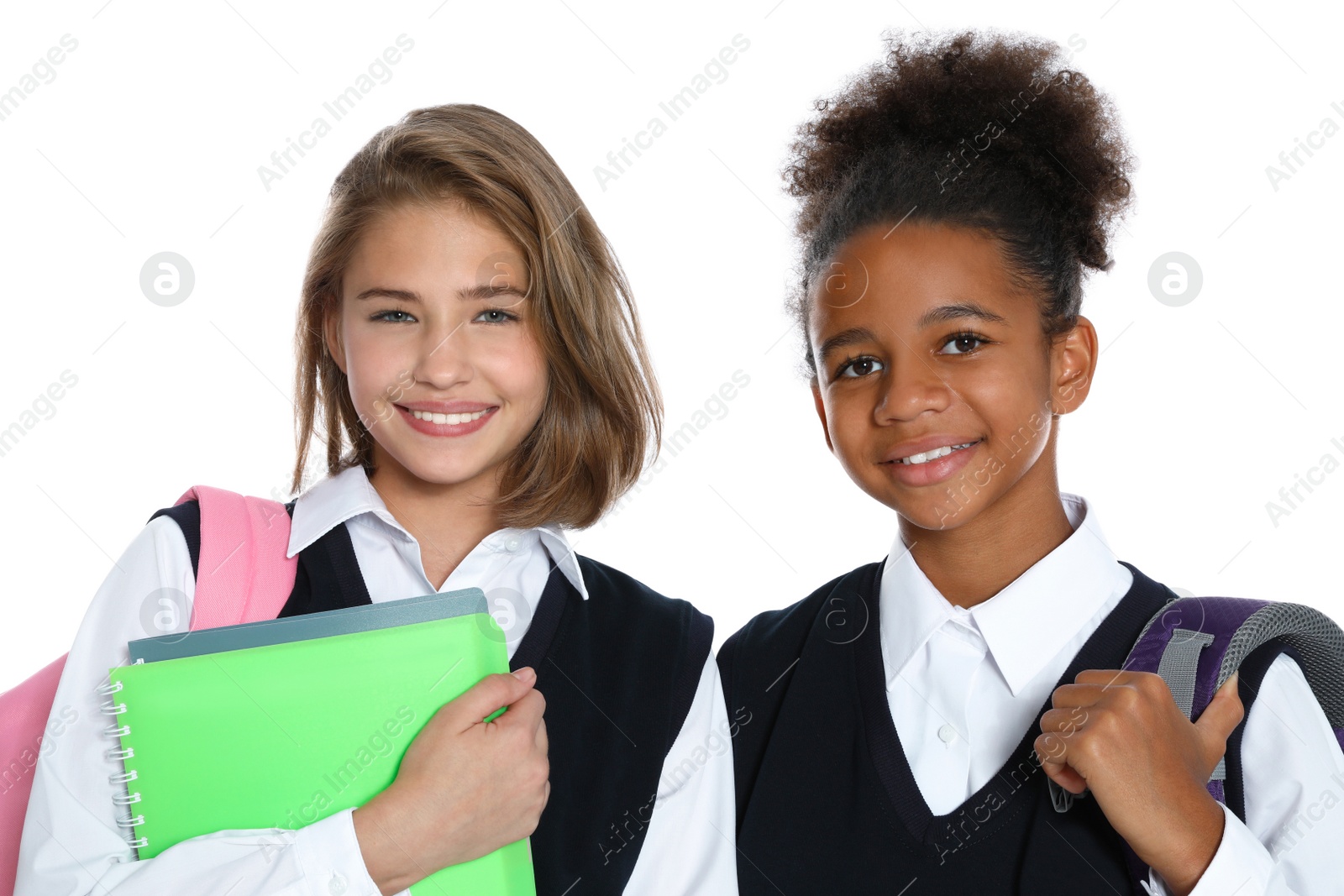 Photo of Happy girls in school uniform on white background