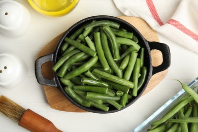 Photo of Flat lay composition with raw green beans on white wooden table