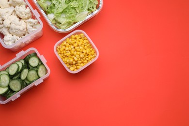 Photo of Plastic and glass containers with different fresh products on red background, flat lay. Space for text