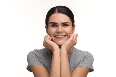 Photo of Young woman with clean teeth smiling on white background