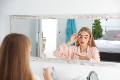 Photo of Young woman with eyelash loss problem indoors