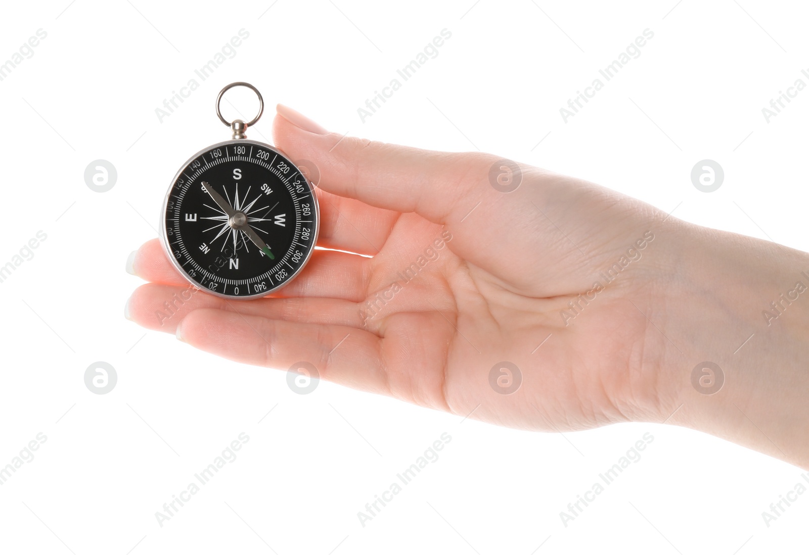 Photo of Woman holding compass on white background, closeup. Tourist equipment