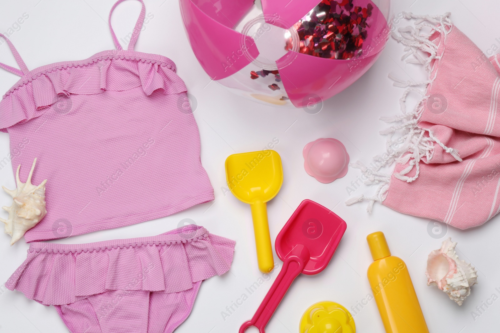 Photo of Flat lay composition with beach ball on white background