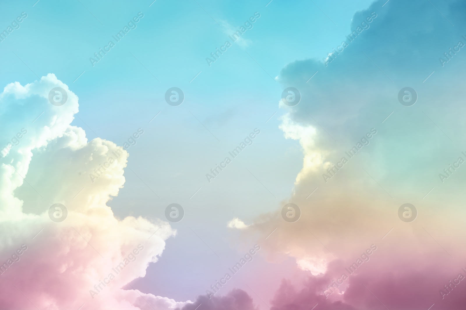 Image of Fantasy world. Picturesque view of beautiful magic sky with fluffy clouds, toned in pastel rainbow or unicorn colors