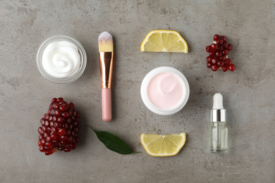 Flat lay composition with natural pomegranate facial mask on light grey table