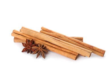 Aromatic cinnamon sticks and anise isolated on white