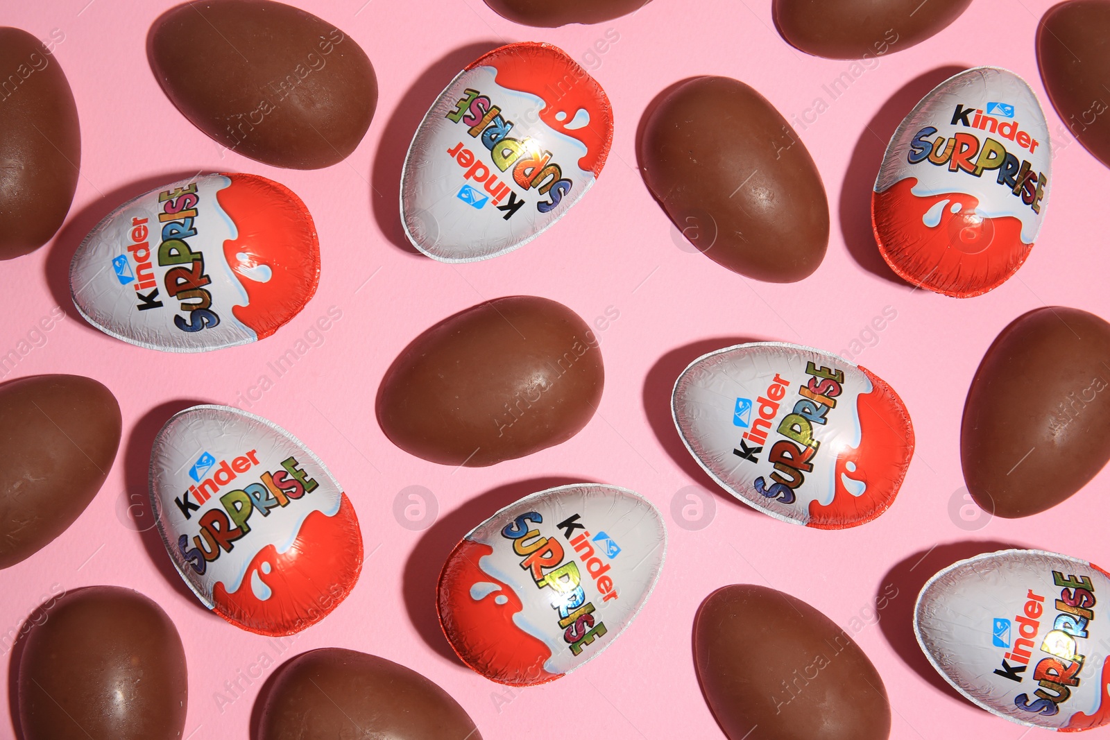 Photo of Sveti Vlas, Bulgaria - June 30, 2023: Kinder Surprise Eggs on pink background, flat lay