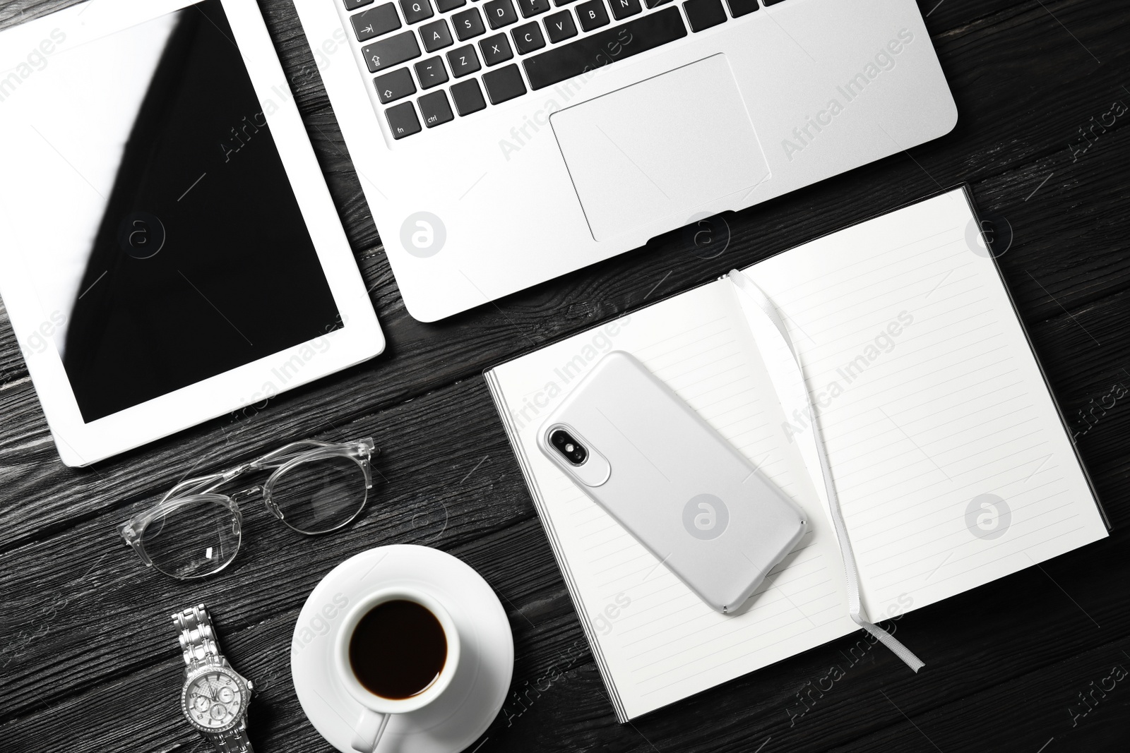 Photo of Flat lay composition with laptop and notebook on wooden table, space for text. Blogger's workplace