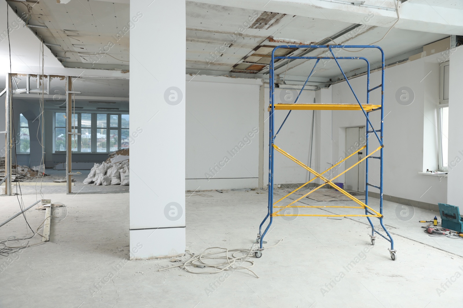 Photo of Scaffolds in messy room prepared for renovation