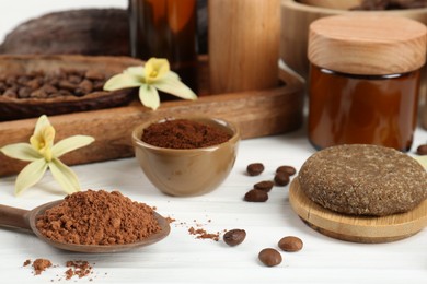 Photo of Homemade cosmetic products and fresh ingredients on white wooden table