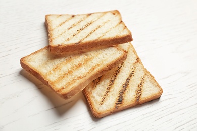 Toasted bread on light background