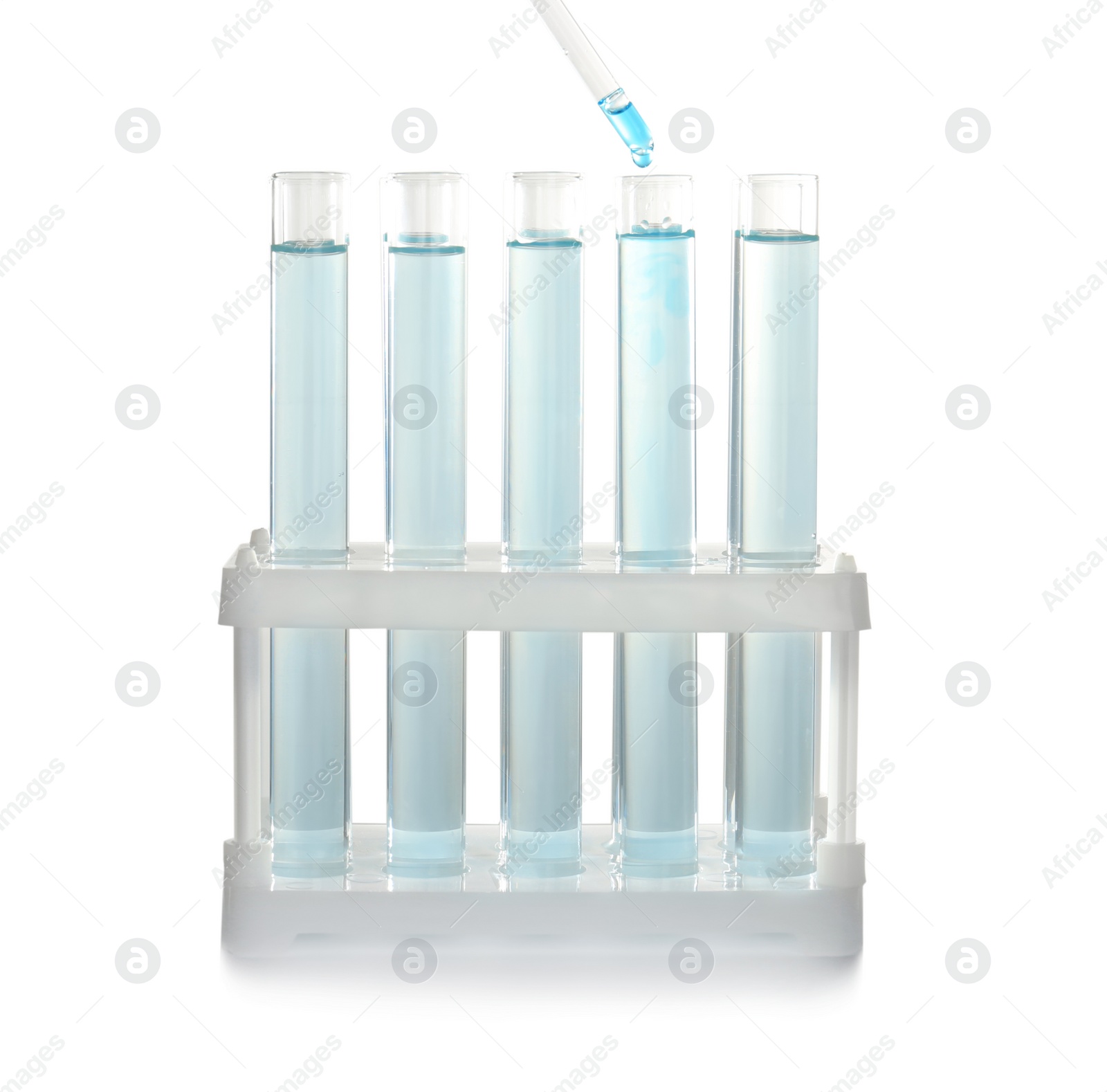 Photo of Dripping reagent into test tube with laboratory sample. Chemical analysis