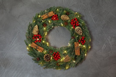 Beautiful Christmas wreath on grey background, top view