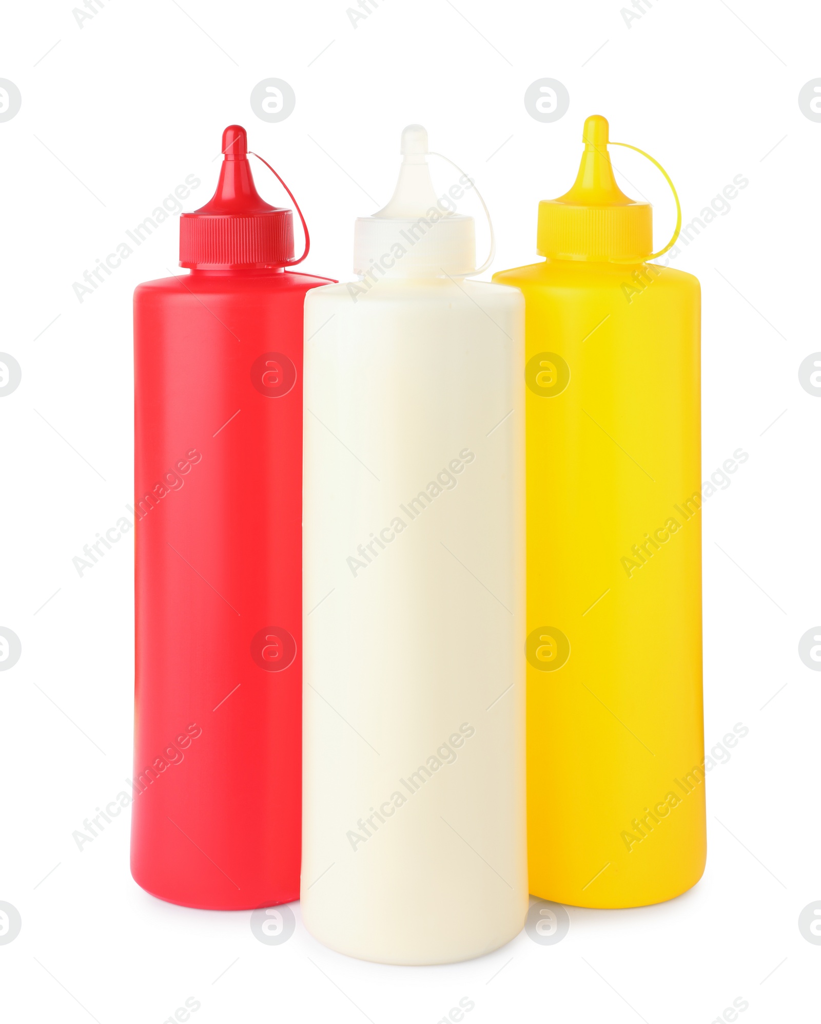 Photo of Plastic bottles of tasty mayonnaise, ketchup and mustard on white background